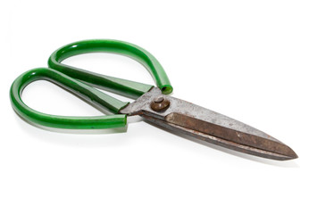 Green scissors isolated on a white background