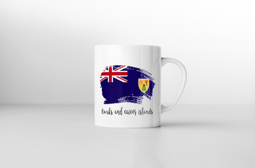 Turks and Caicos Islands flag souvenir mug on white background.