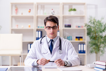 Young doctor sitting in the office