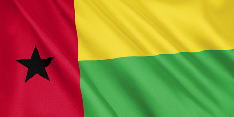 Guinea-Bissau flag waving with the wind, wide format, 3D illustration. 3D rendering.
