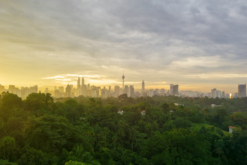 Majestic sunrise over KL Tower and surrounded buildings in downtown Kuala Lumpur, Malaysia.	