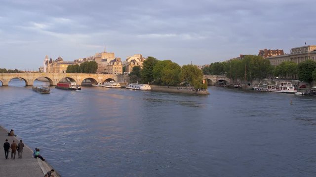 Tourists taking pleasure trips on the River Seine Paris in natural and illuminated light, Paris, France, Europe - T/Lapse