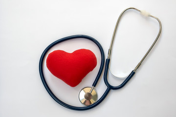 Red heart with stethoscope on white background, healthcare.