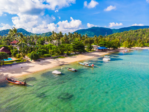 Aerial view of beautiful tropical beach and sea with palm and other tree in koh samui island