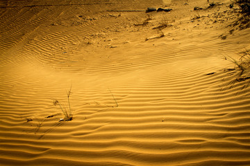 Desert - colourful patterns & sky is visible behind