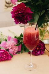 Delicious cocktail with grapefruit on wooden table