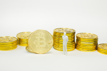 white miniature and gold coin bitcoin abstract image close up background.