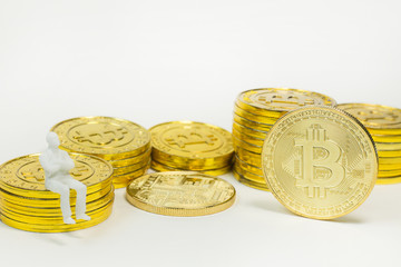 white miniature and gold coin bitcoin abstract image close up background.