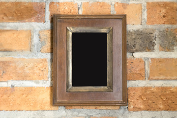 wood picture frame on the brick wall.