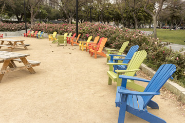 Colorful Adirondack chairs at Plaza de Cesar Chavez Park in Downtown San José, Silicon Valley, Northern California, USA.