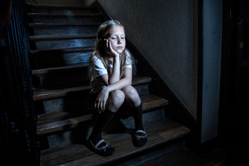 Beautiful lonely young girl depressed and worried suffering from bullying and harassment at school