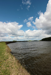 the beautiful landscape with low clouds over the river