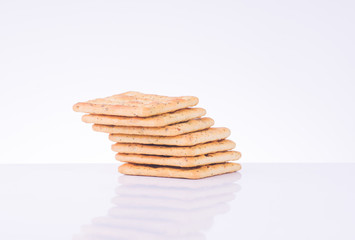 Stack of vegetable cream cracker.Vegetable biscuit isolated over white background.
