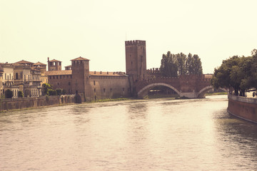 Verona cityscape view on the riverside with historical buildings