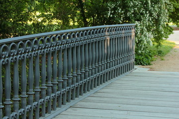 wooden bridge with a metal balustrade