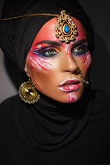 portrait of a girl in a black scarf with a bright make-up