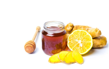 Jar of honey and lemon gingers isolated on white background