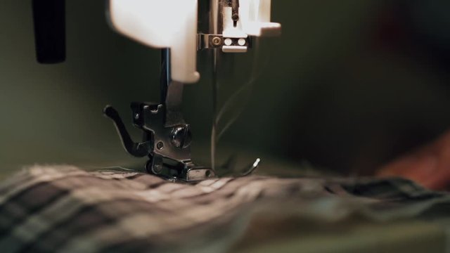 Macro shot of sewing machine in process, close up