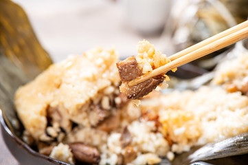 zongzi(rice dumpling) filling close-up shot on a wood table, Dragon Boat Festival, Asian traditional food, Chinese