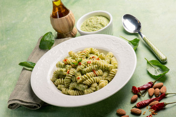 fusilli with pesto sauce and hot chili pepper