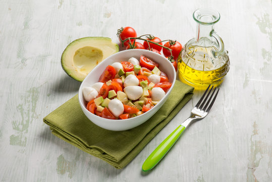 salad with mozzarella tomatoes and avocado