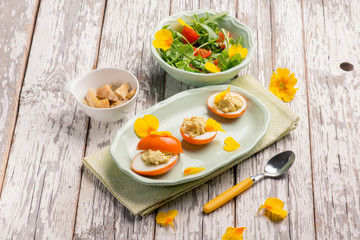 curcuma stuffed egg with mixed salad