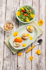 curcuma stuffed egg with mixed salad