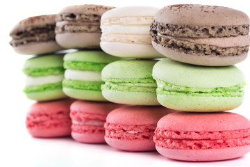 a row of cakes of different taste and color on a white background