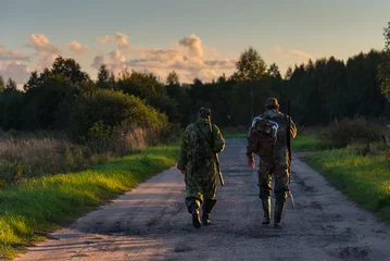 Foto op Canvas Two hunters go on an evening hunt © Никита Хохловский