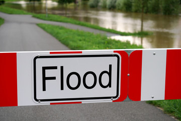 flood barrier sign, road blocked due to flooding