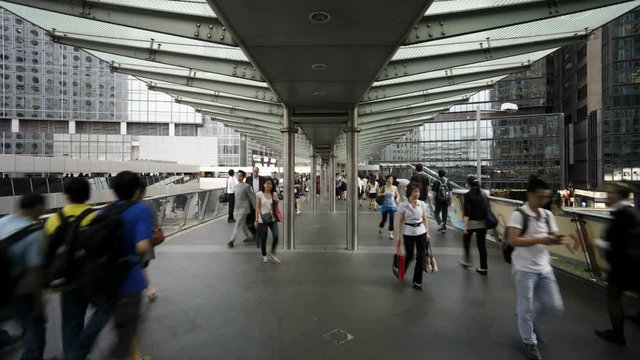 People walking across an elevated walkway in Central, Hong Kong Island, Hong Kong, China, T/lapse