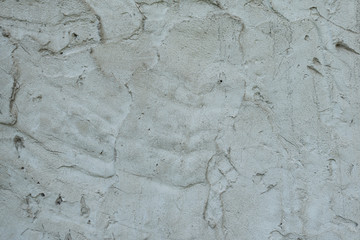 Wall fragment with scratches and cracks
