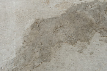 Wall fragment with scratches and cracks