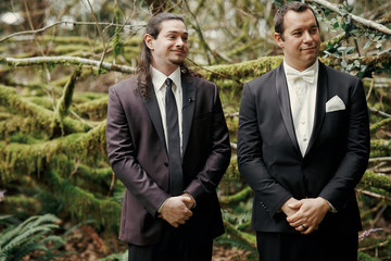 Groom looks loverly waiting with groomsman for a bride