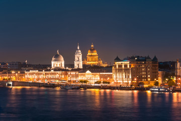 Night view of the Church of St. Catherine the Great Martyr and St. Isaac's Cathedral at the Neva River.