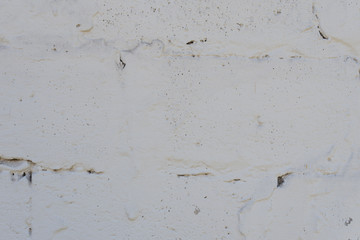 Wall fragment with scratches and cracks