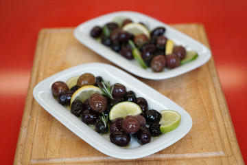 black olives served in authentic greek style. selective focus.