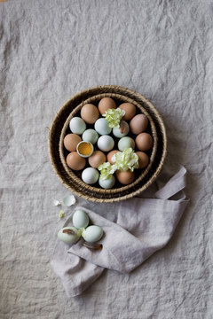 Multicoloured eggs in a basket