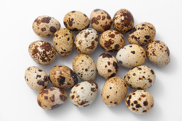 eggs quail spotted small on white background.