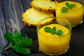 Homemade mango and pineapple smoothie made with coonut milk