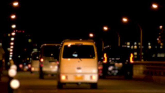 TOKYO,  JAPAN - CIRCA MAY 2018 : Scenery of ROAD TRAFFIC at NIGHT,  Many car passing at busy street around Akabane area.  In blurred image.