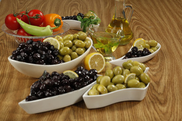green and black olives on a plate

