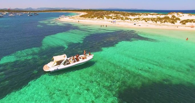 Aerial view of Yatch with friends in amazing, unspoiled and idyllic beach on a little island