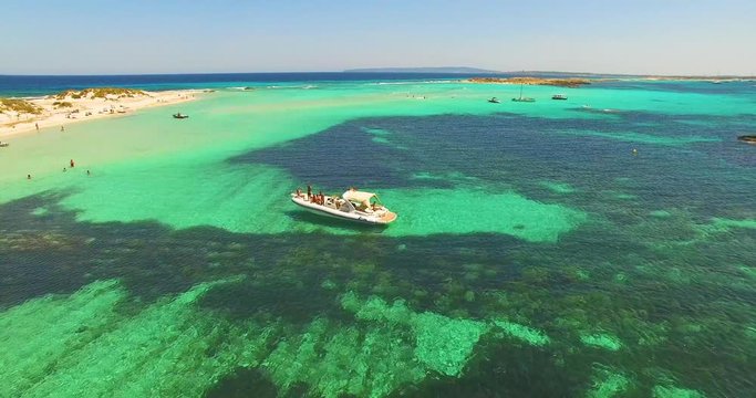 Aerial view of Yatch with friends in amazing, unspoiled and idyllic beach on a little island