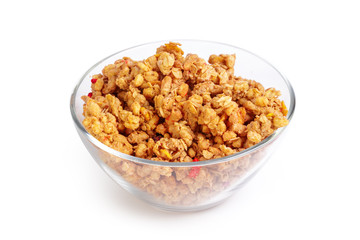 Bowl of whole grain muesli isolated on white background