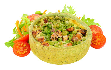 Pea and pancetta filled savoury quiche with fresh simple salad isolated on a white background