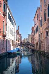 Fototapeta na wymiar Bridge over residential Venice Canal 
