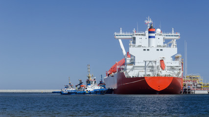 LNG TANKER - A red ship at the gas terminal