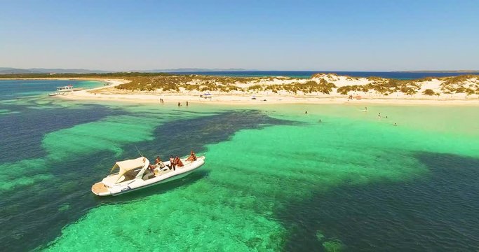 Aerial view of Yatch with friends in amazing, unspoiled and idyllic beach on a little island