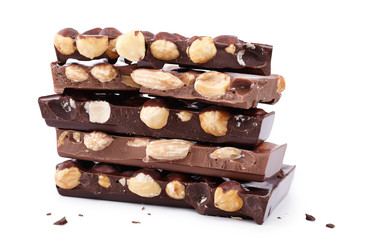 pieces of chocolate with nuts, close-up delicacy isolated on white